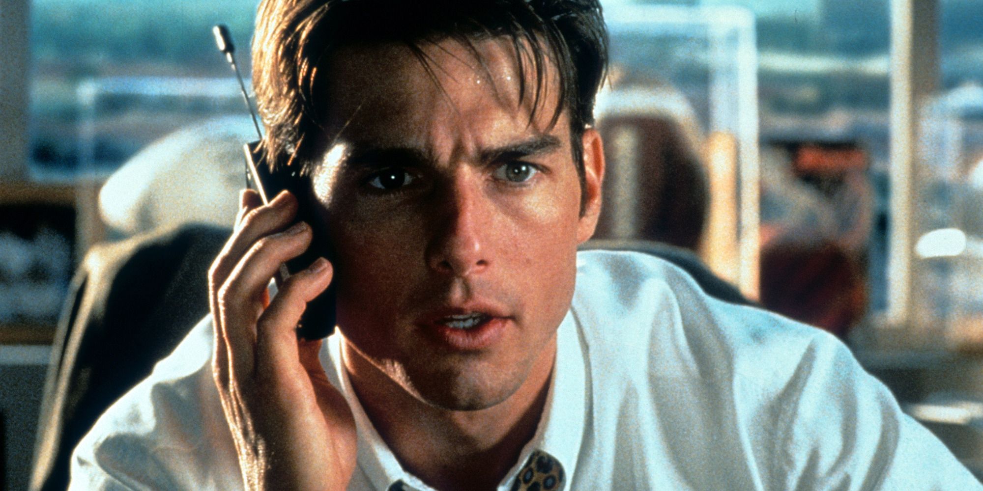 Tom Cruise in Jerry Maguire talking on the phone in his office.