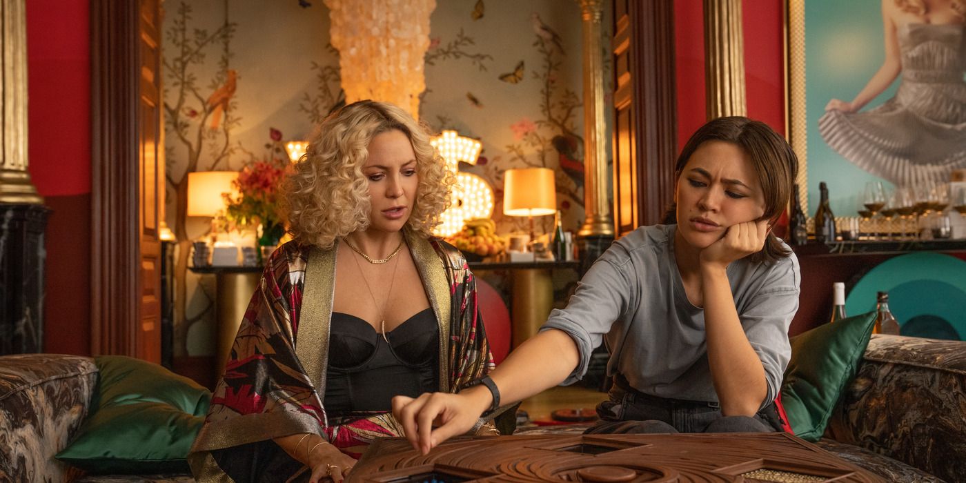 Kate Hudson as Birdie J and Jessica Henwick as Peg working on a puzzle box in Bow of Glass: The Secret to Get Knives.