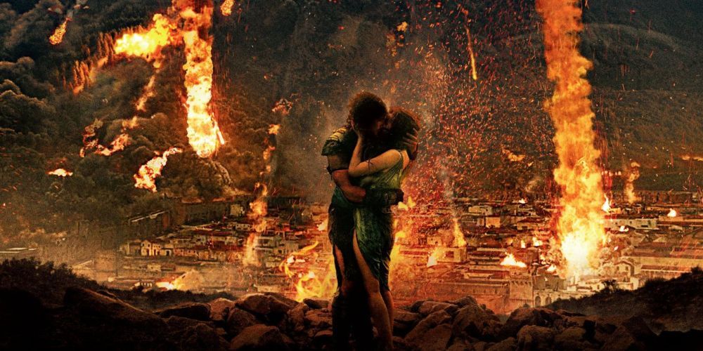 Milo and Cassia embrace as Pompeii is destroyed in Pompeii.