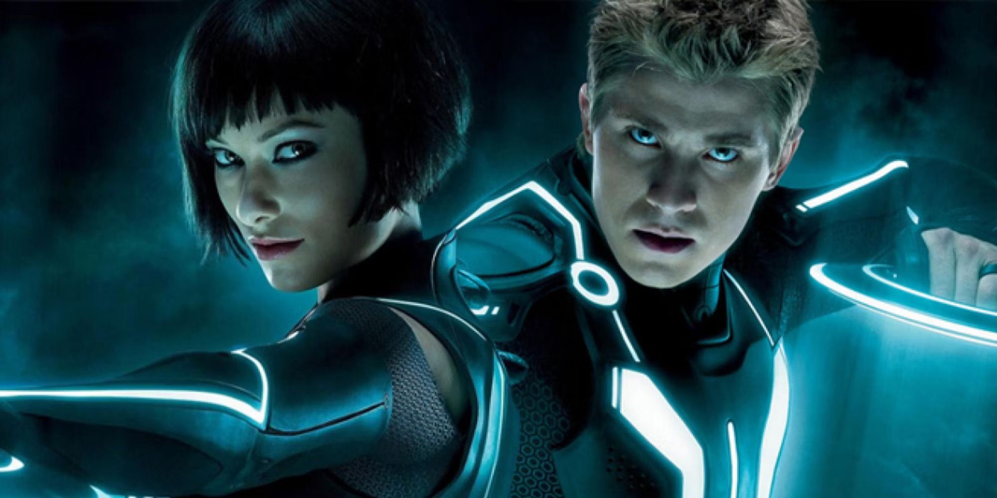 Sam Flynn and Quorra holding Tron: Legacy ID discs