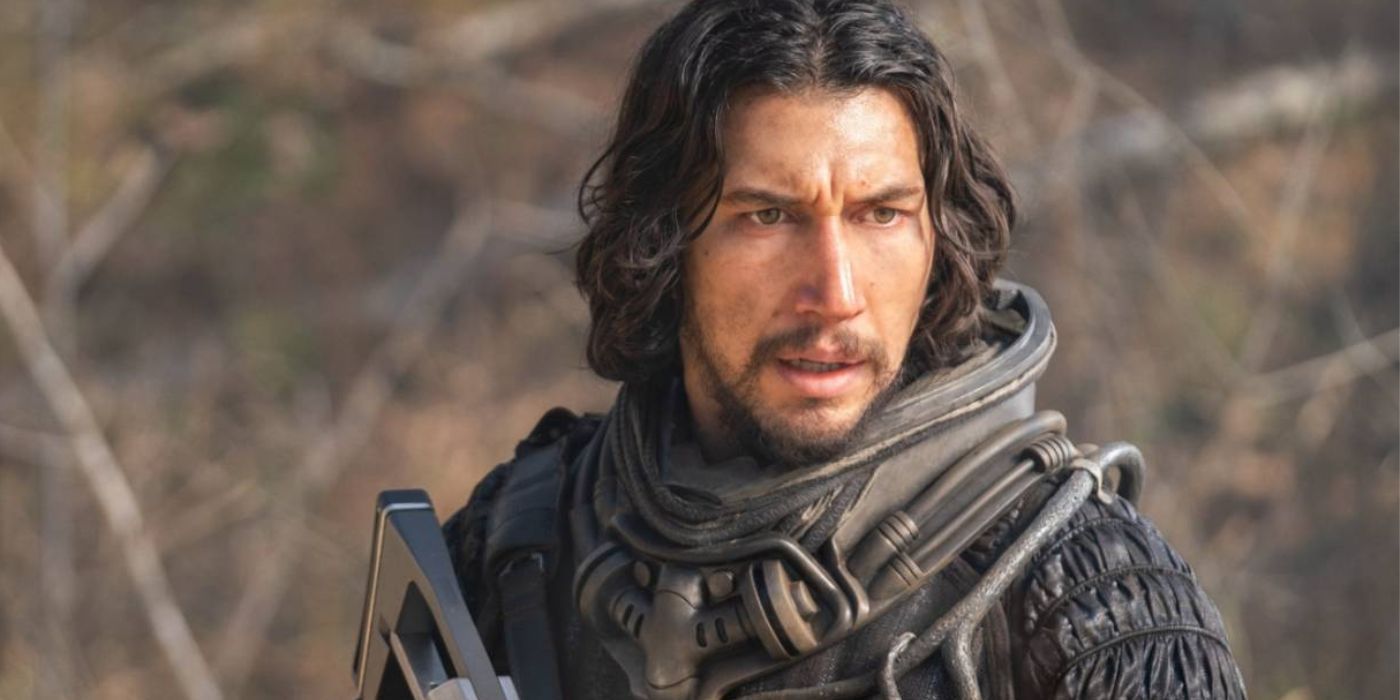 Adam Driver in a space suit with a futuristic pistol in 65