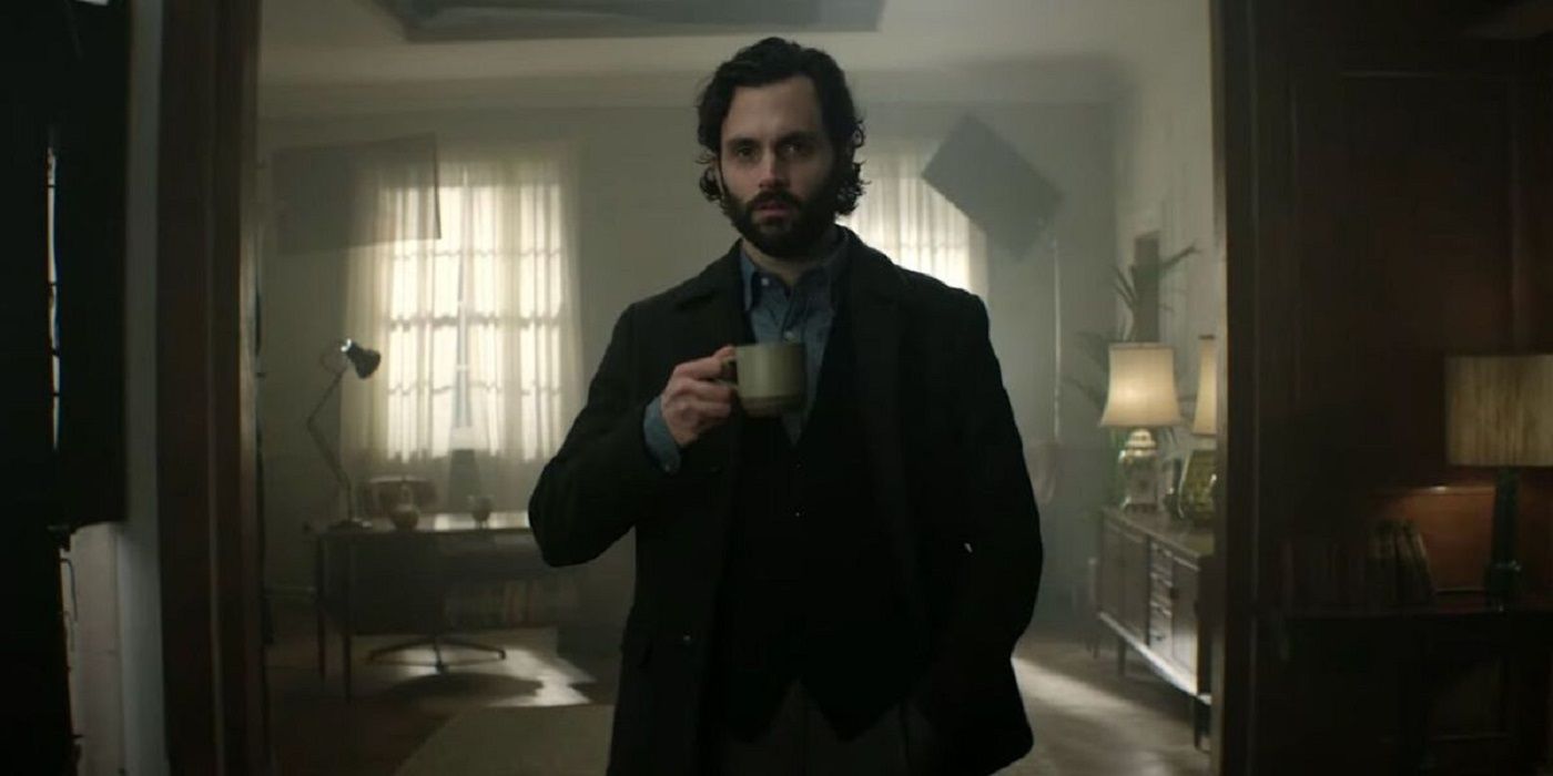 Joe Goldberg, played by Penn Badgley, as Professor Jonathan Moore in his apartment drinking coffee in Season 4 of You.