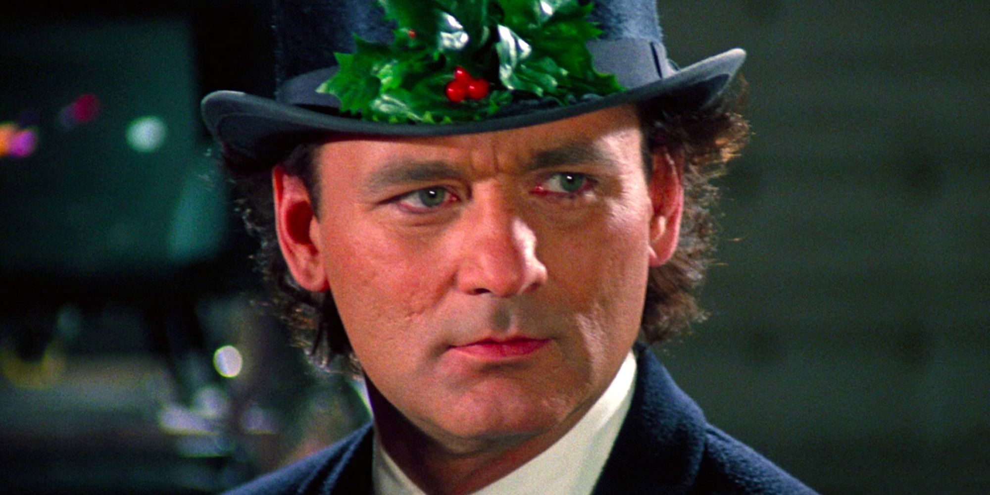 Frank Cross wears a holly top hat.