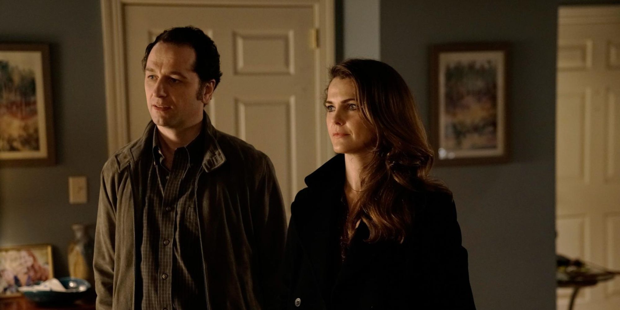 Philip and Elizabeth Jennings stand side by side and look in the same direction in The Americans.