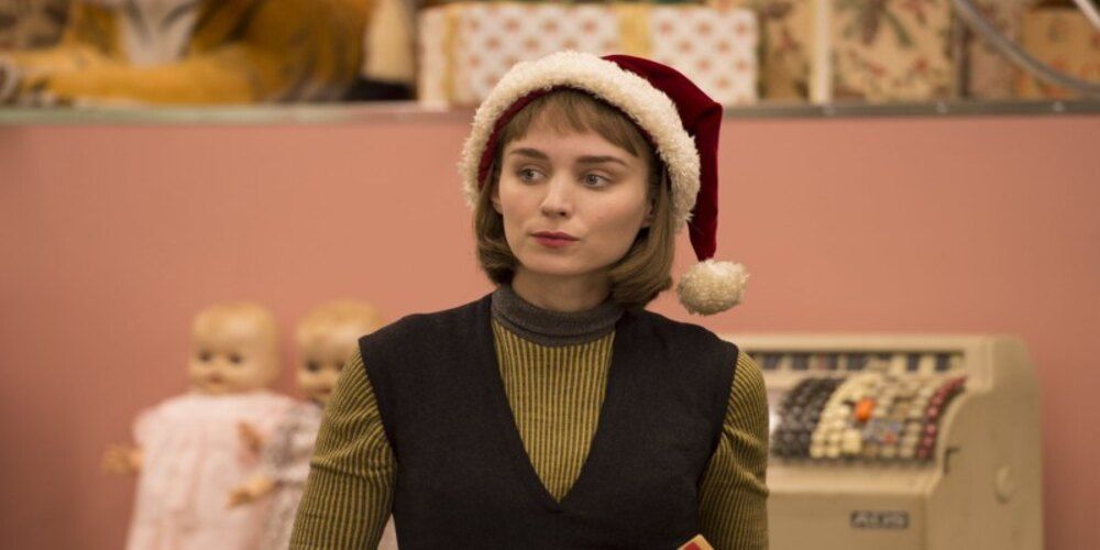 Teresa in the store looks off into the distance at Carol.