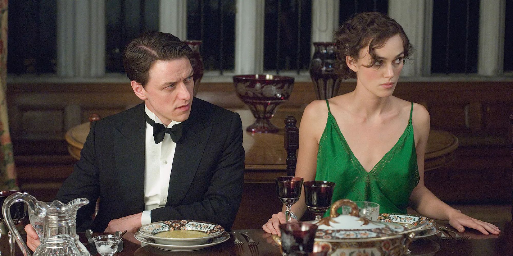 Robbie and Cecilia sit at a table at a fancy dinner at Atonement.
