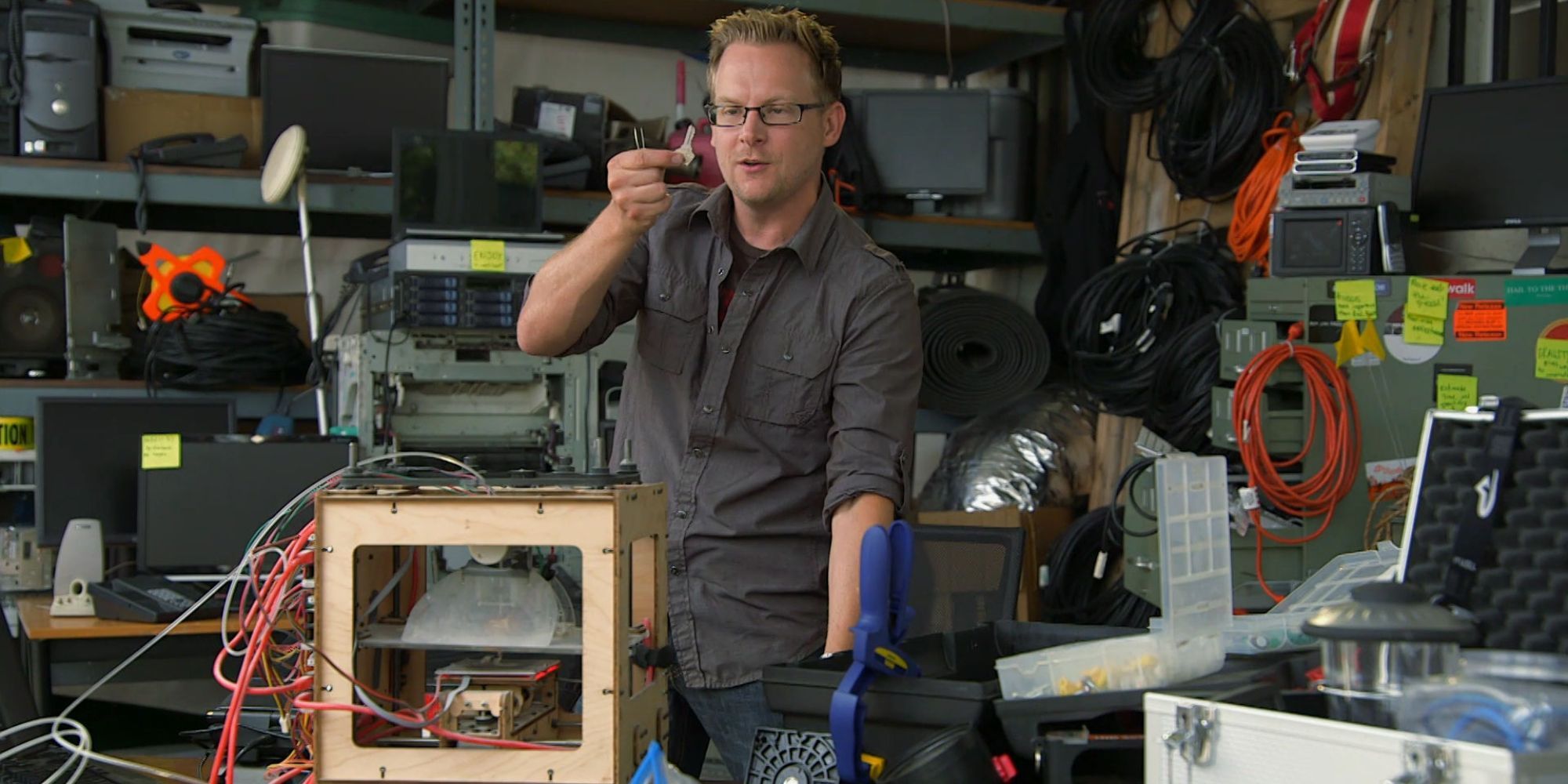Brian Braswell inspecting a small mechanism