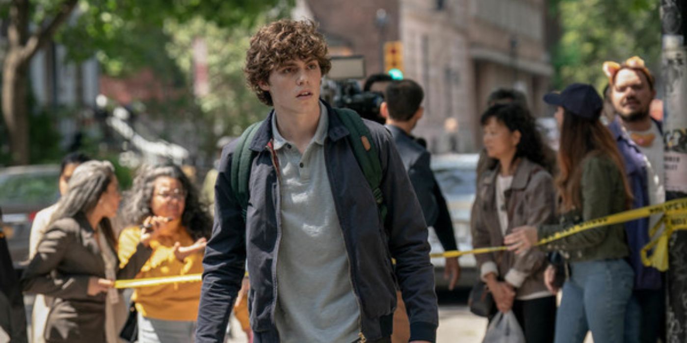 Jack Champion as Ethan walks through a crime scene in Scream 6.