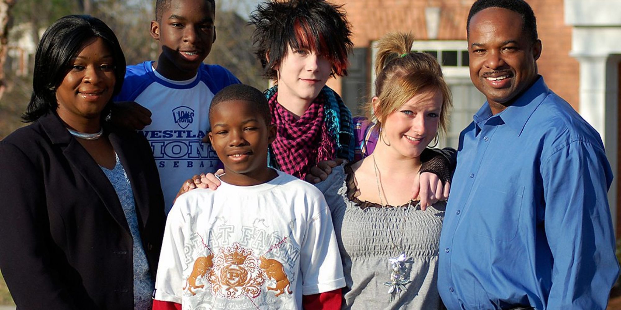 Two troubled teenagers with their foster family