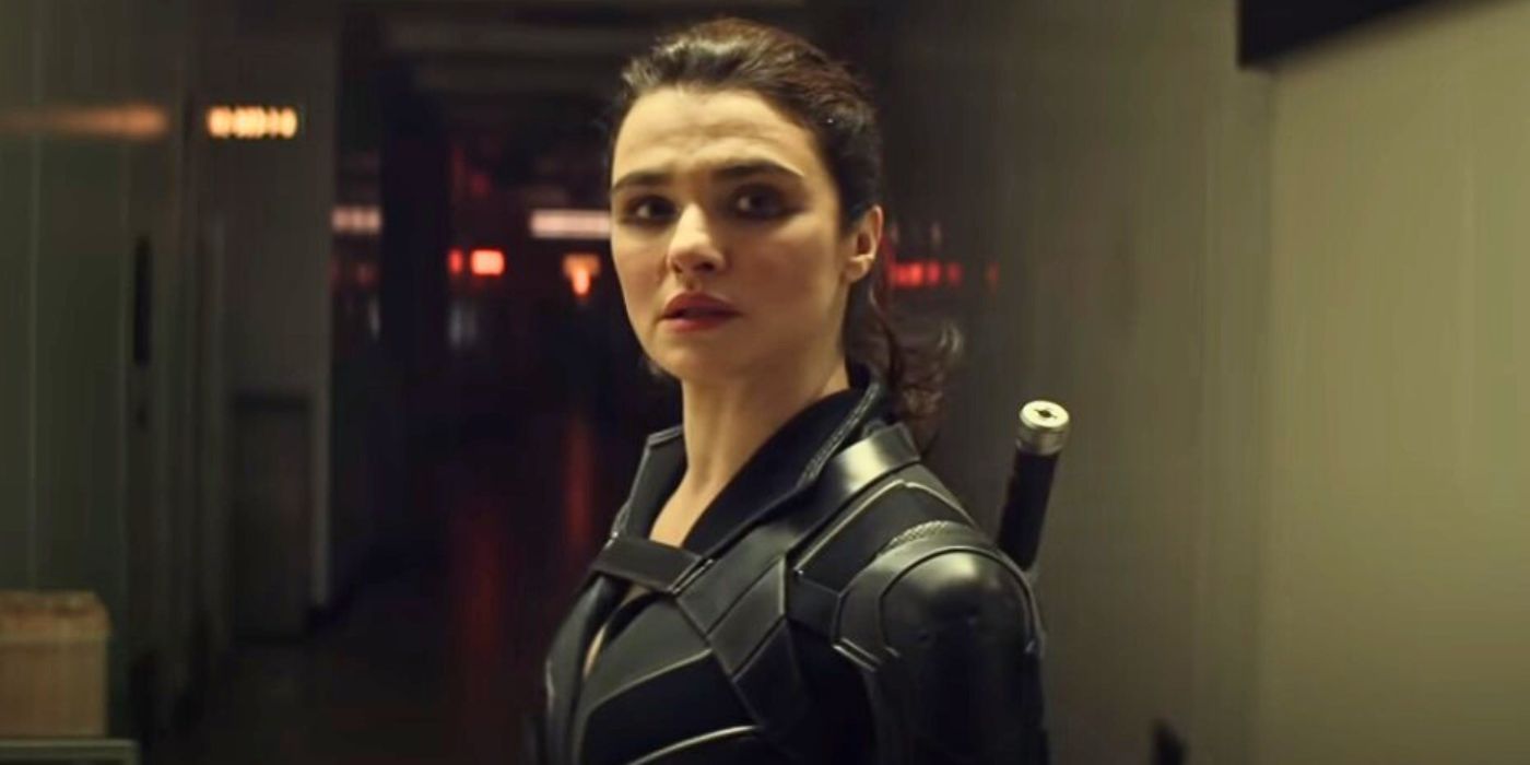 Rachel Weisz stands alone in the hallway in Black Widow
