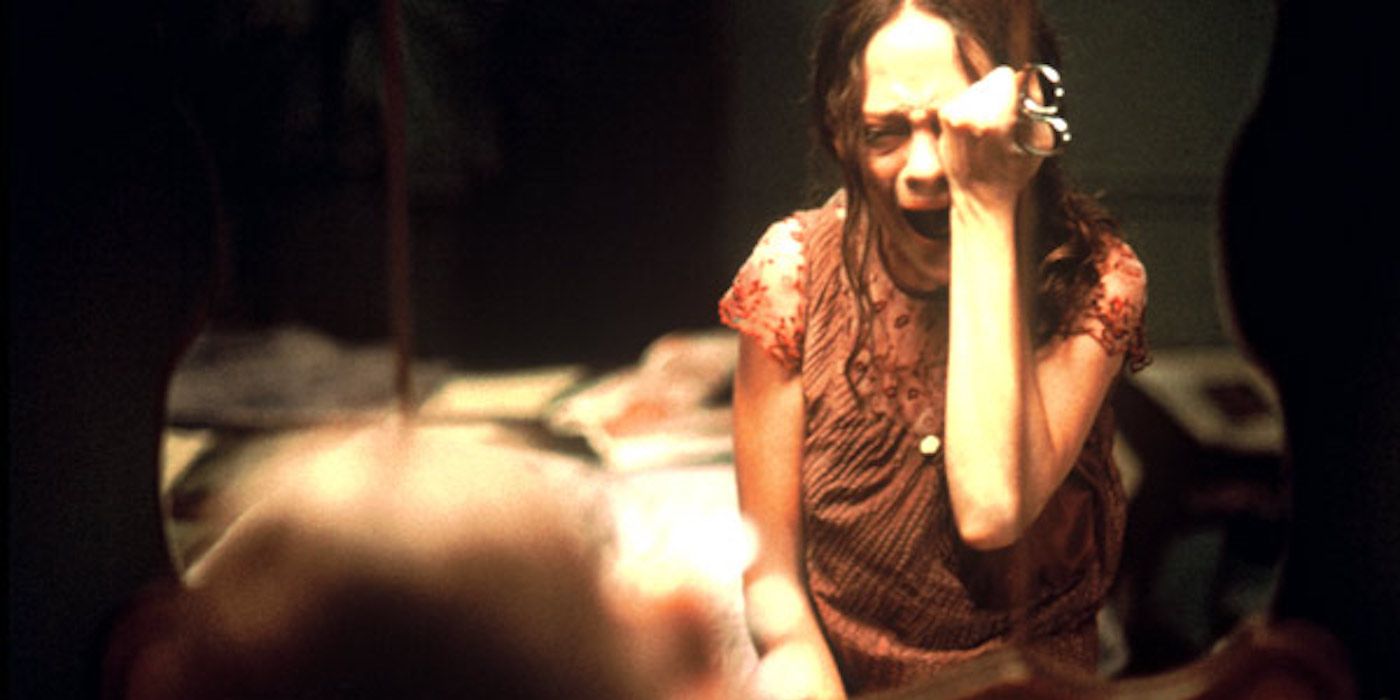 Mei pierces her eye in May 2002.