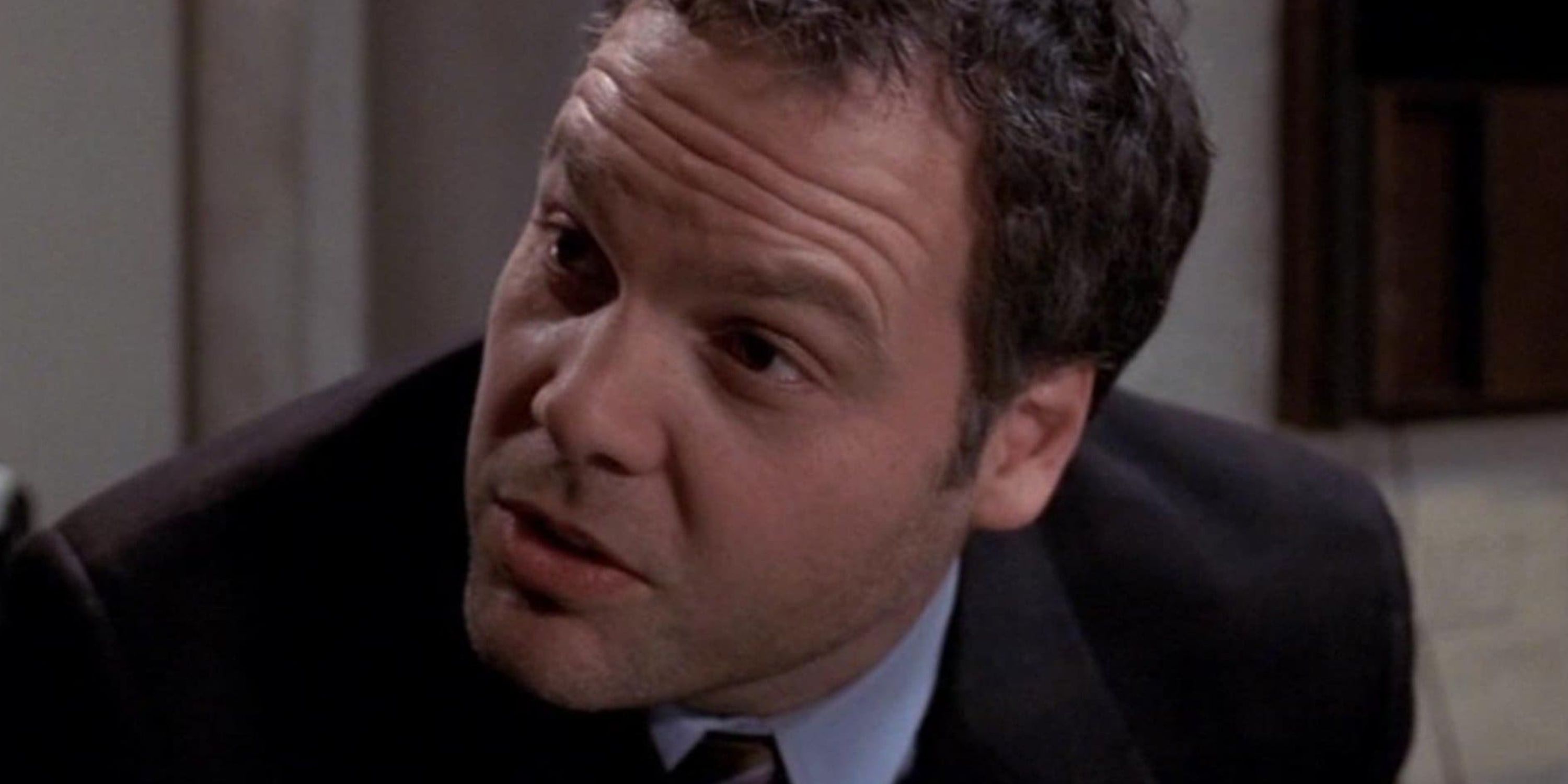 A man in a suit speaks outside the courthouse